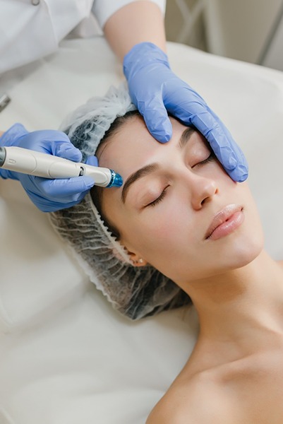 view-from-rejuvenation-beautiful-woman-enjoying-cosmetology-procedures-beauty-salon-dermatology-hands-blue-glows-healthcare-therapy-botox (1) (1)